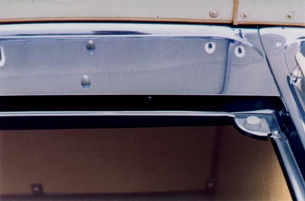 The bullet shaped rubber cushions on the upper deck are unlike anything manufactured today. They are fastened from the bottom with unfinished #8 x 7/16" round head wood screws. Note the unbuffed satin finish in the trough area around the decklid opening.