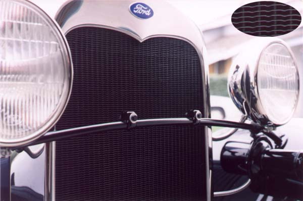 The original radiator core had one column of fin "dips" or dimples between each vertical front tube. The edges of the fins were folded under about 1/16" making the fins appear nearly 3 times as thick on the front and rear edges.