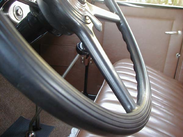 This close-up view of the steering wheel shows the fresh moulded finish of the rubber type material. The flashing or mould seam was neatly ground as can be seen on the spokes. The perimeter was ground lengthwise around the wheel making it less obvious.