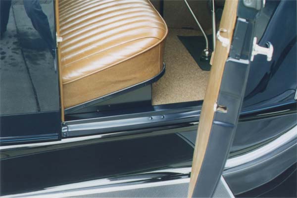 Another view of the front floor. The carpeting or "tapestry" as Ford described it, was closely tinted to match the surrounding interior trim. The door windlace and wire-on trim on the quarters are made from genuine leather, as are the seating surfaces and welting. Note the contrasting unbuffed paint in the door openings.