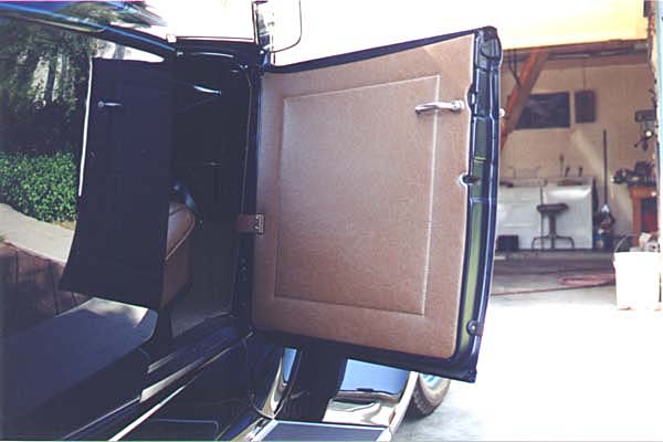 The center of the door panel is embossed. This was originally done by die stamping the cardboard panels. This 1/8" off-set also provided a guide for the stitching pattern during production.