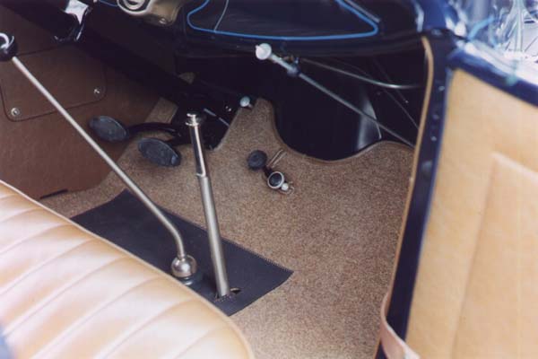 Another view of the front carpet detail. Note the matching edge binding and the small hole surrounding the throttle and foot rest.