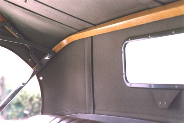 Another view of the inside top. The rear curtain was made from a special "double texture curtain material", which was made of three layers of fabric laminated instead of just two. This extra strength eliminated the need for a reinforcing strip along the front vertical edge of the rear quarter curtains.