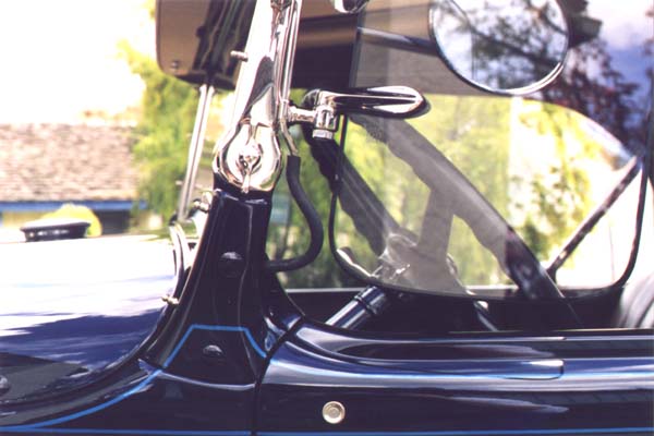 Beginning October 1930 all laminated glass including windwings had a black sealer around the perimeter. It was embedded in the lamination (between the glass layers) 1/16"-1/8" deep.