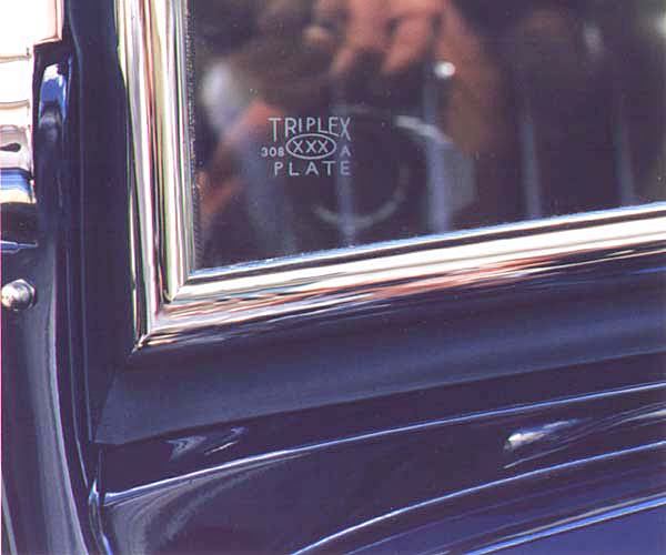 This view shows the Dated "bug" on the windshield. This one is dated two months prior to the construction of this car which was quite common during this time period. Also visible is the painted lead bead between the lower stanchion and dash rail panel. One of the many distinguishing features of the original windshield frame is the square, electrically butt welded seam between the sections. Replacements are generally welded from outside creating a rounded joint when finish ground.