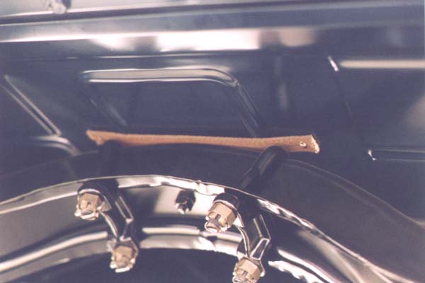 This view is of the bottom side of the body from the rear of the car. It shows the deep stampings of the front lip of the original rumble seat riser and the original "X" pan just forward of the riser.
