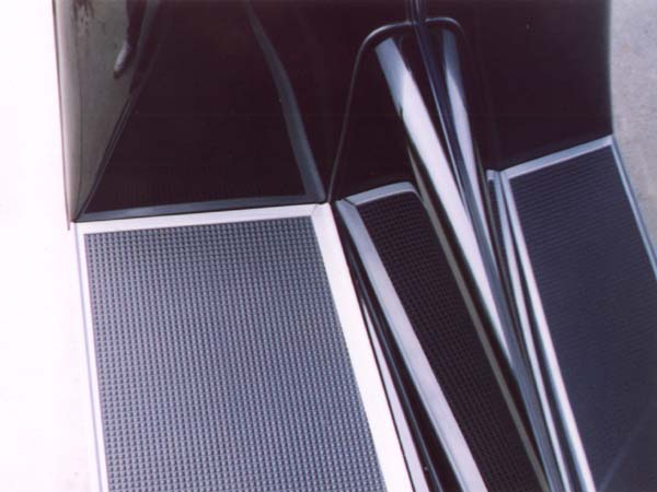 The original running board matting had a slightly smaller pyramid pattern, or more pyramids per square inch than the modern replacements.